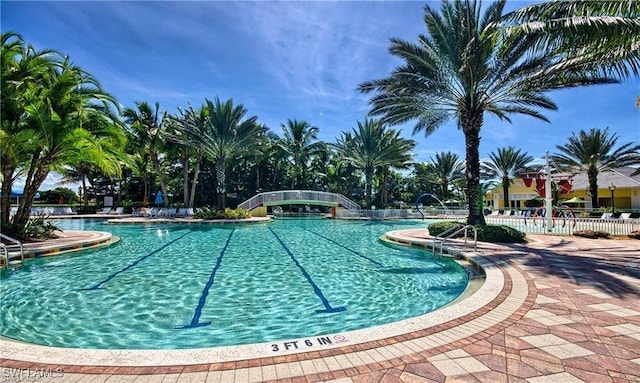 view of swimming pool featuring a patio