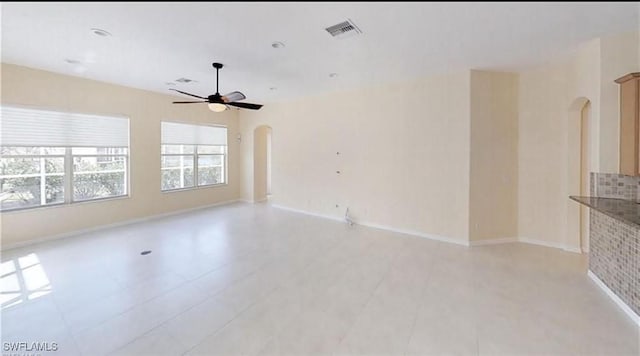 spare room with ceiling fan