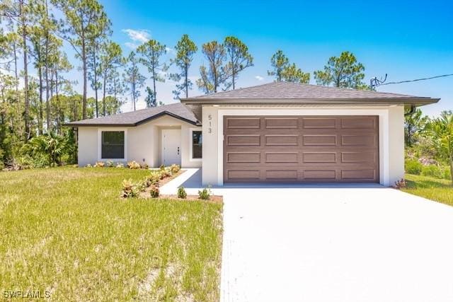 single story home featuring a front yard