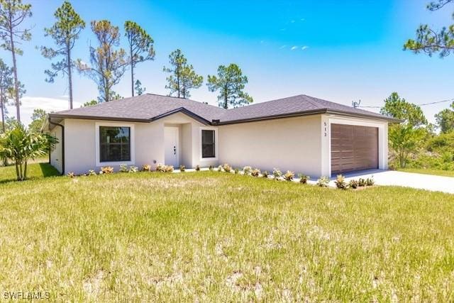 ranch-style home with a garage and a front yard