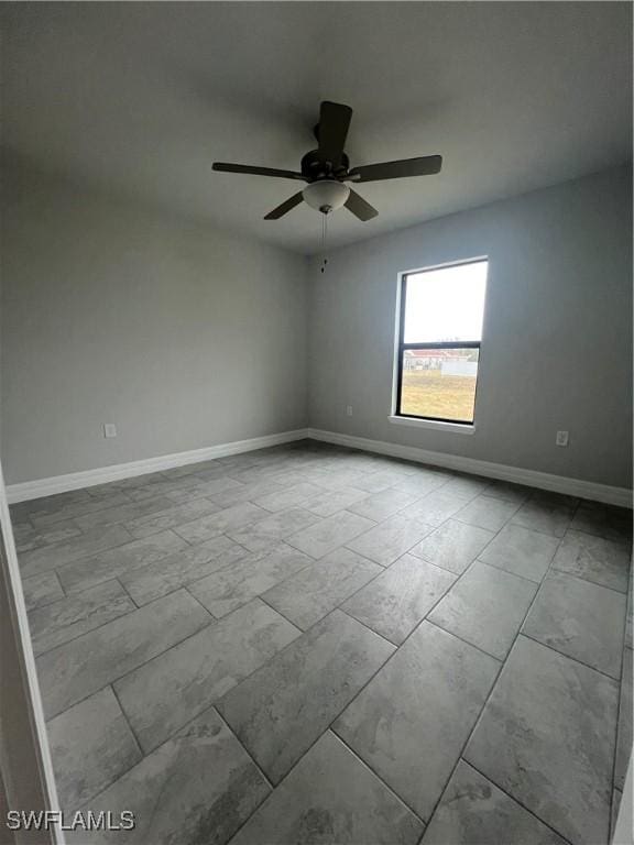 unfurnished room with ceiling fan