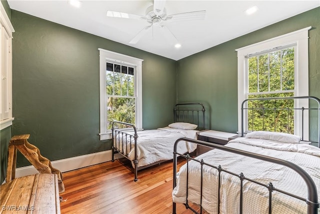 bedroom featuring hardwood / wood-style floors and ceiling fan