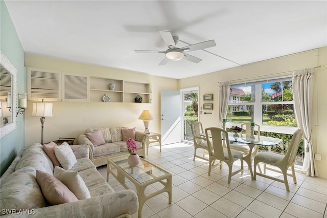 tiled living room with a wealth of natural light and ceiling fan