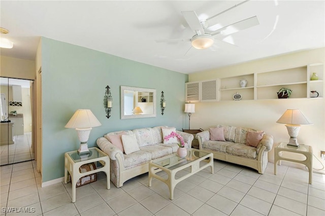 living room featuring ceiling fan and light tile patterned floors