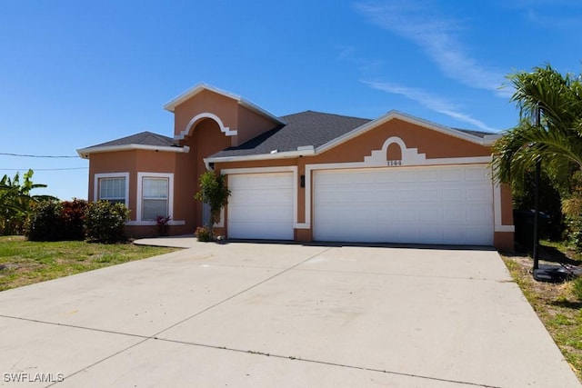 ranch-style home featuring a garage