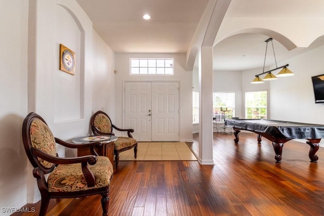 entrance foyer with hardwood / wood-style floors and billiards