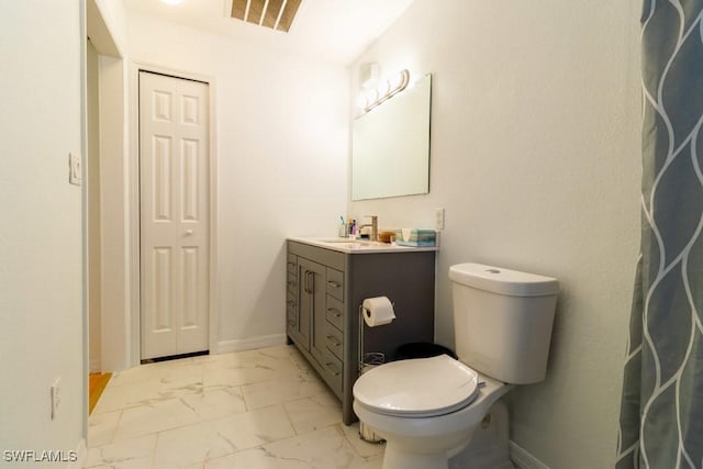 bathroom with vanity and toilet