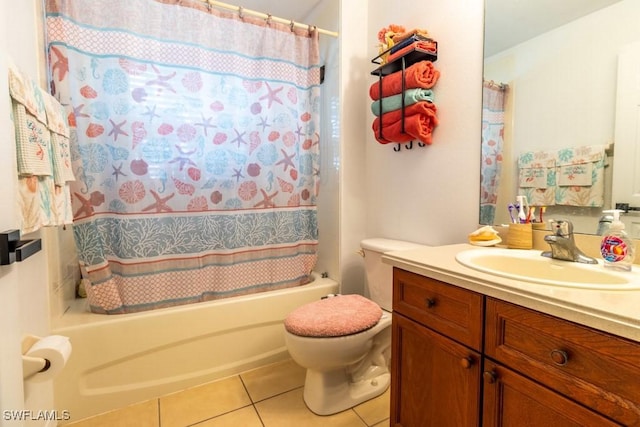 full bathroom featuring tile patterned flooring, vanity, toilet, and shower / bathtub combination with curtain