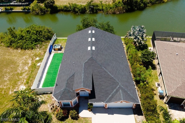 birds eye view of property featuring a water view