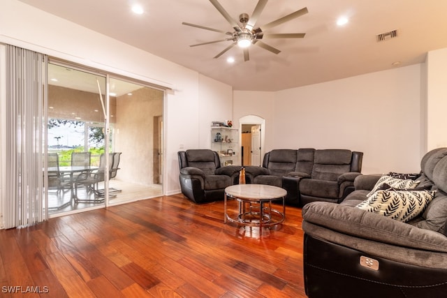 living room with ceiling fan and wood-type flooring