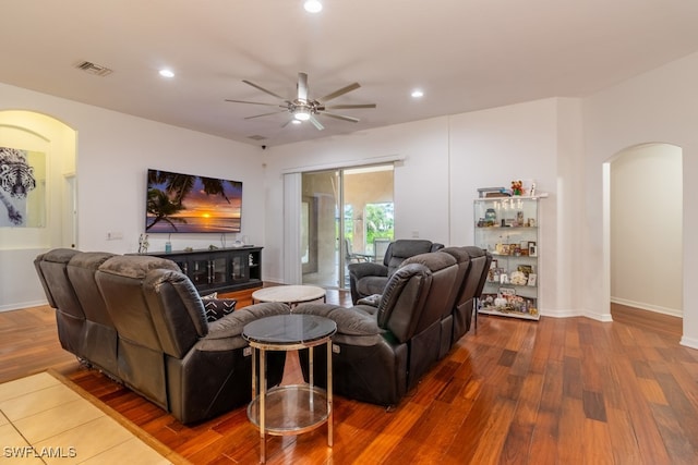 living room with hardwood / wood-style flooring and ceiling fan