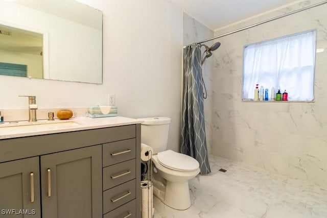 bathroom featuring vanity, curtained shower, and toilet