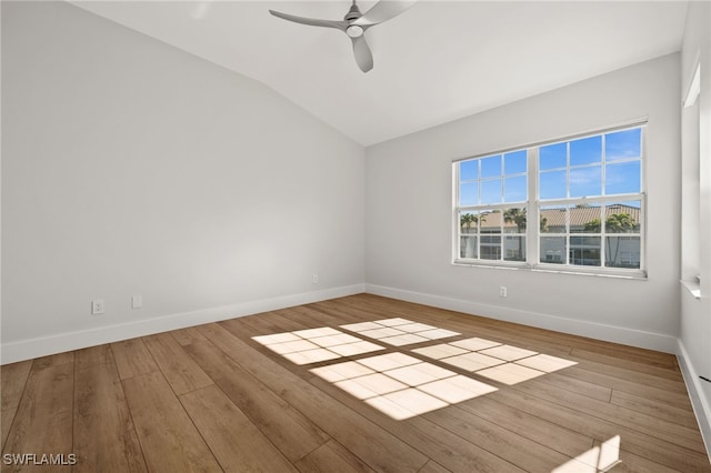 unfurnished room with ceiling fan, lofted ceiling, and light wood-type flooring