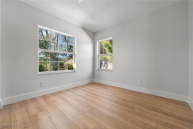 spare room with light hardwood / wood-style floors