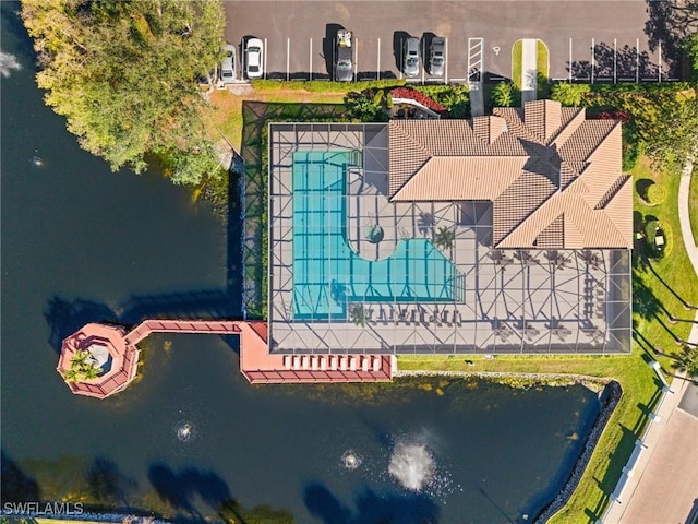 birds eye view of property with a water view