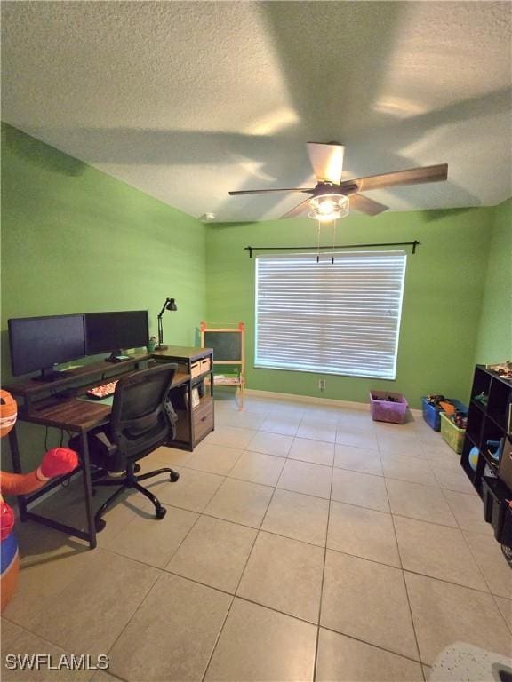 office space featuring ceiling fan, a textured ceiling, and light tile patterned flooring