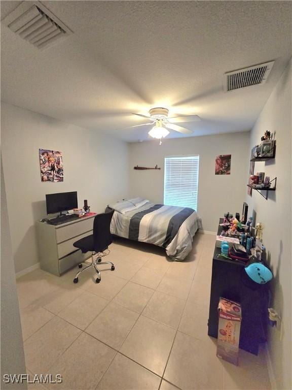 tiled bedroom featuring ceiling fan