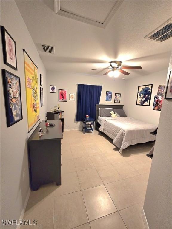 tiled bedroom featuring ceiling fan