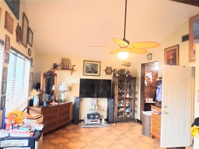 living room with ceiling fan and lofted ceiling