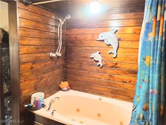 bathroom featuring wood walls and shower / tub combo with curtain