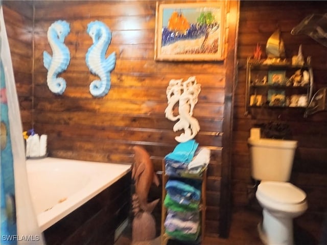 bathroom featuring log walls, vanity, and toilet