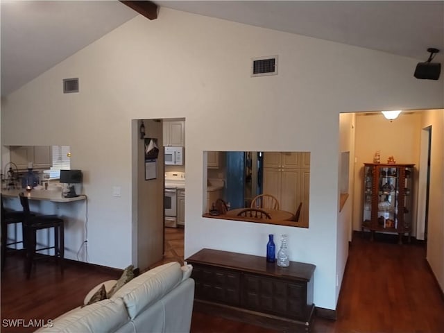 living room featuring beam ceiling, dark hardwood / wood-style flooring, and high vaulted ceiling