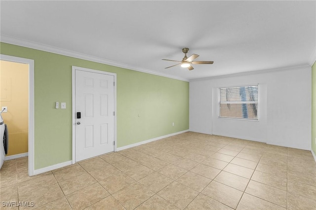 spare room featuring ornamental molding, light tile patterned flooring, a ceiling fan, and baseboards