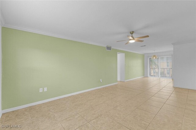 unfurnished room with visible vents, ornamental molding, light tile patterned flooring, ceiling fan, and baseboards