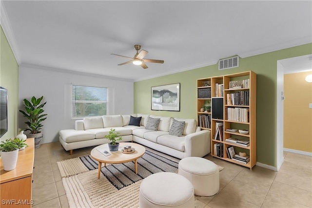 living area with light tile patterned floors, ceiling fan, visible vents, and ornamental molding