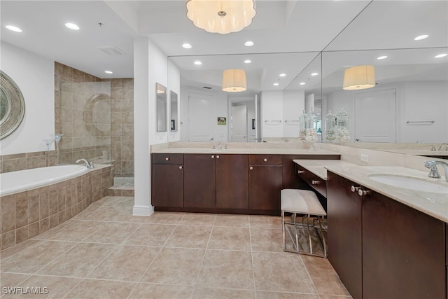 bathroom with tile patterned flooring, recessed lighting, a bath, and walk in shower