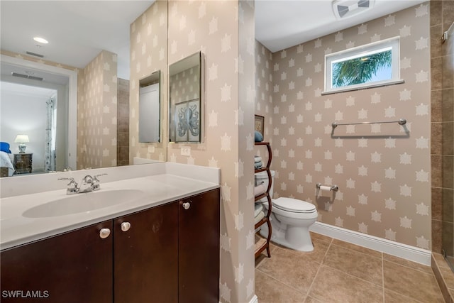 bathroom featuring visible vents, baseboards, toilet, tile patterned floors, and vanity