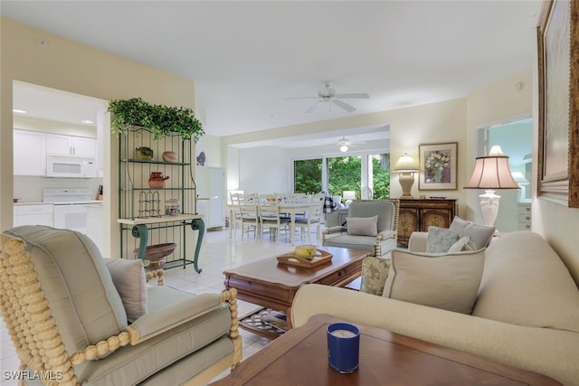 tiled living room with ceiling fan