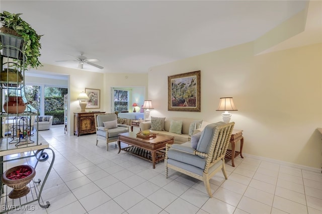 living room featuring light tile patterned floors and ceiling fan