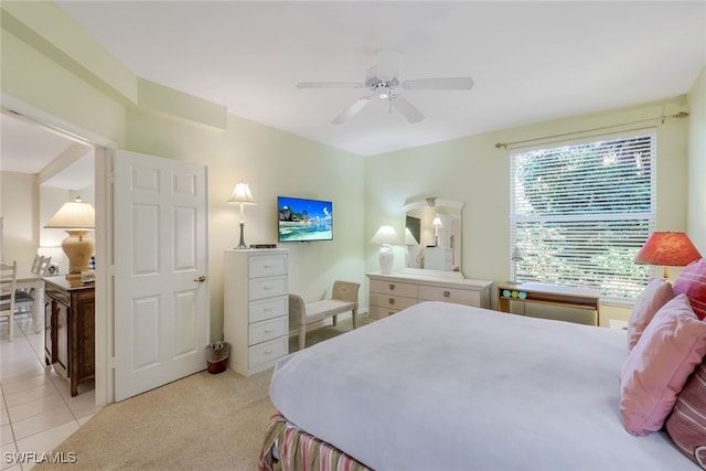 bedroom featuring light tile patterned flooring and ceiling fan