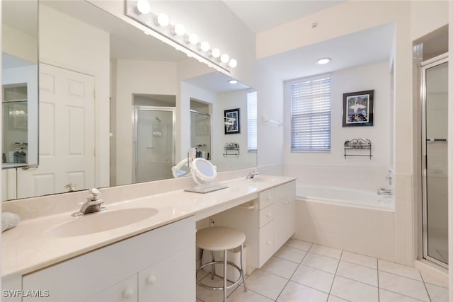 bathroom featuring vanity, tile patterned floors, and separate shower and tub