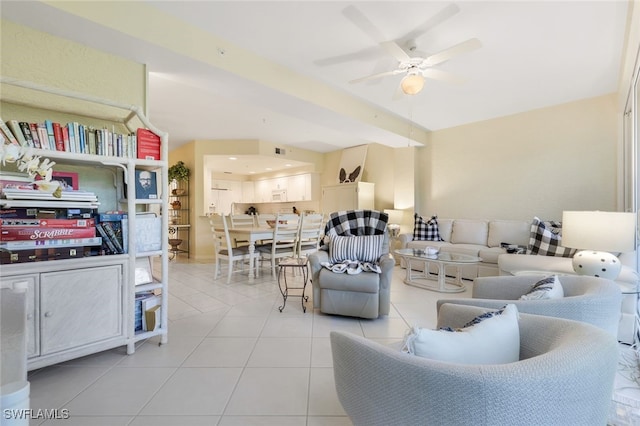 tiled living room with ceiling fan