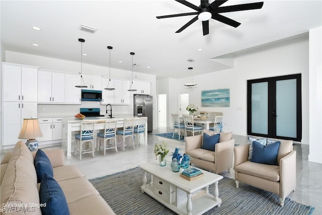 living room featuring french doors, a ceiling fan, visible vents, and recessed lighting