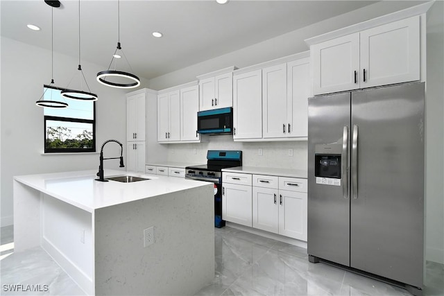 kitchen with appliances with stainless steel finishes, a sink, white cabinetry, and decorative backsplash