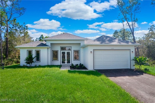 view of front of property featuring a garage, a front yard, and french doors