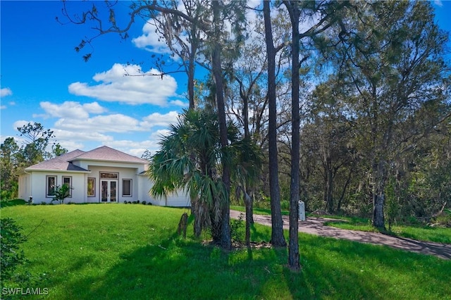 exterior space featuring a front lawn