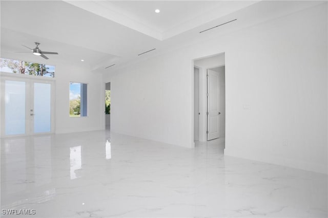 unfurnished room with ceiling fan, french doors, and ornamental molding