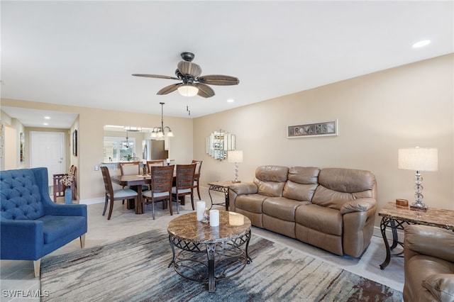 tiled living room with ceiling fan