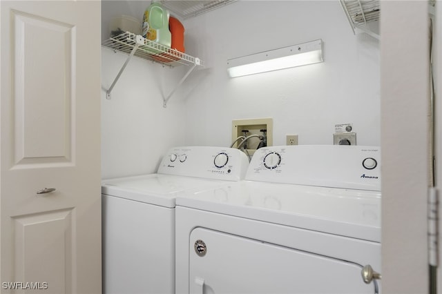 laundry room featuring washing machine and clothes dryer