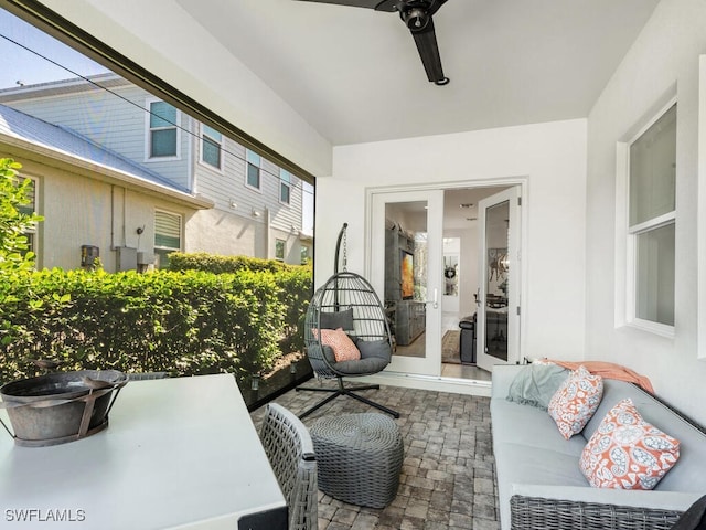 view of patio featuring outdoor lounge area, ceiling fan, and french doors