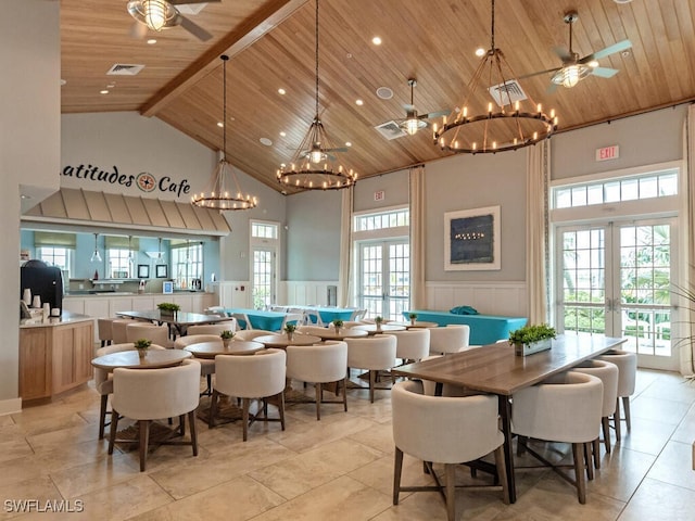 dining room with wood ceiling, high vaulted ceiling, and french doors