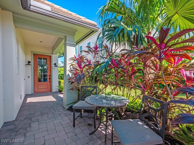 property entrance featuring a patio