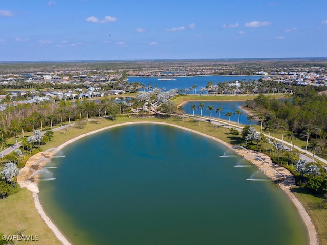 bird's eye view featuring a water view and a beach view