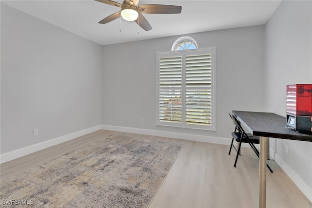 home office featuring ceiling fan and light hardwood / wood-style floors