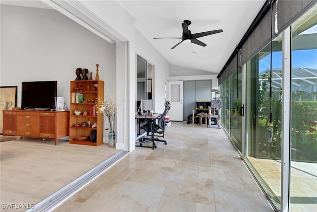 interior space featuring ceiling fan and lofted ceiling