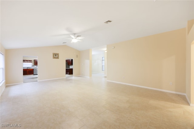 unfurnished living room featuring ceiling fan and lofted ceiling